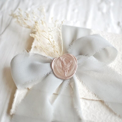 frayededgerippedsilkribbonfordiyweddingsgiftpackagingdecorationgrey.png