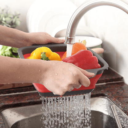 siliconefoldinganddrainingbasketmakeswashingfruitsandvegetableseasyred.png