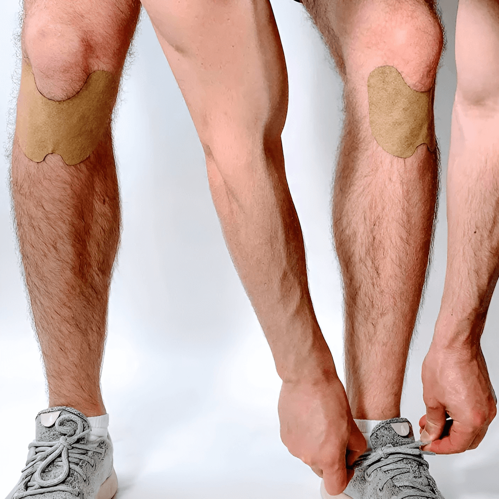 Herbal knee pain patches applied to a knee for relief