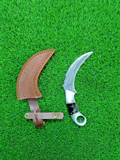 Damascus karambit knife with rain drop pattern and steel bolster, bull horn