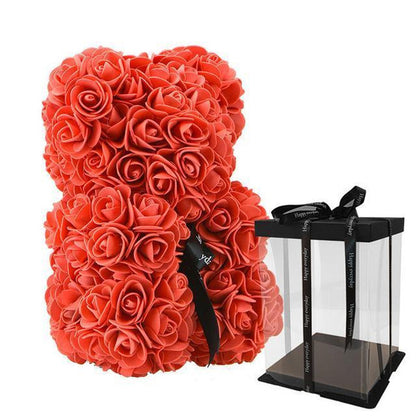 teddy bear covered in Red roses