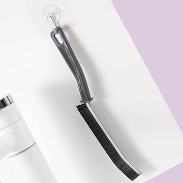 Longhandled crevice brush for easy access