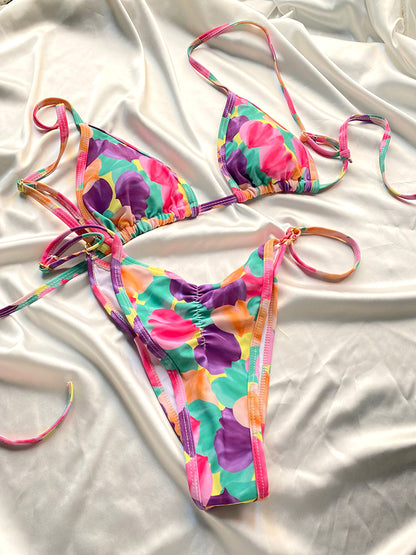 Woman wearing tie dye bikini set relaxing at sunny beach scene