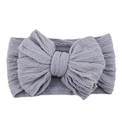 SnuggleSoft Baby Bow Headband  Stretchy Nylon Hair Accessory For Newborns And Toddlers 12